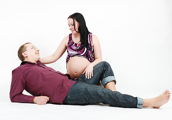 Image showing Young happy couple. Husband and pregnant wife