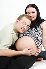 Image showing Young happy couple. Husband and pregnant wife