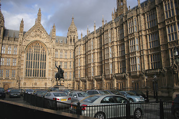 Image showing rider, horse and cars