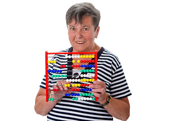 Image showing Senior woman calculating with abacus