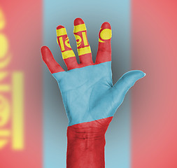 Image showing Palm of a woman hand, painted with flag