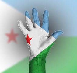 Image showing Palm of a woman hand, painted with flag