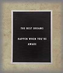 Image showing Dreams - Inspirational quotation about life on a very old menu b