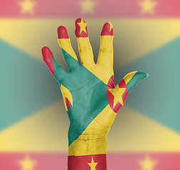 Image showing Palm of a woman hand, painted with flag