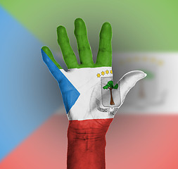 Image showing Palm of a woman hand, painted with flag