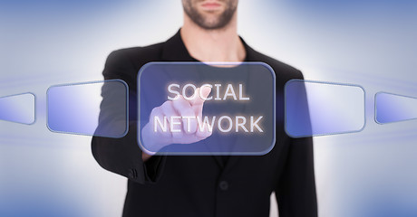 Image showing Business hand pushing the social media virtual button