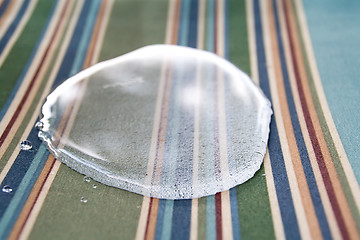 Image showing Beaded water in a puddle