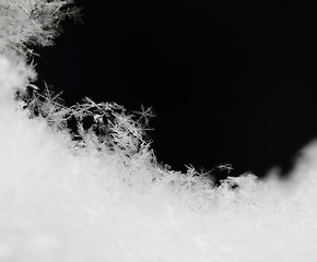Image showing Snowflake in white snow