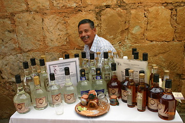 Image showing Man with bottles of Mezcal, Mexico