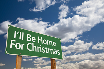 Image showing I'll Be Home For Christmas Green Road Sign Over Sky