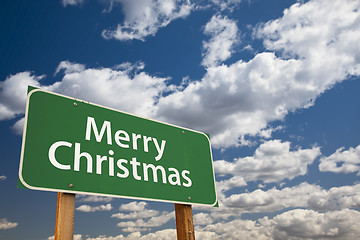Image showing Merry Christmas Green Road Sign Over Clouds and Sky