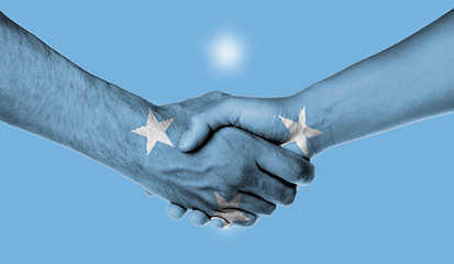 Image showing Man and woman shaking hands