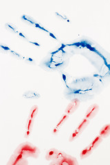 Image showing Blue and red hand-print shape