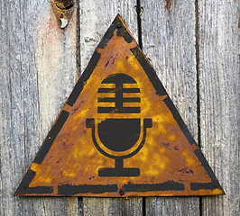 Image showing Microphone Icon on Rusty Warning Sign.