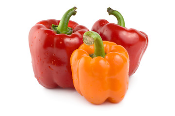 Image showing Two red and one orange pepper