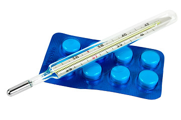 Image showing Thermometer with pills isolated