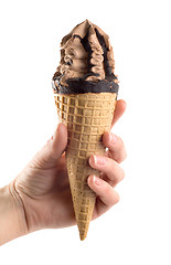 Image showing An ice cream in a hand is isolated