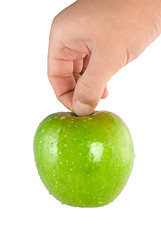 Image showing Green apple in hand (Path)