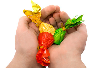 Image showing Candies in a hand