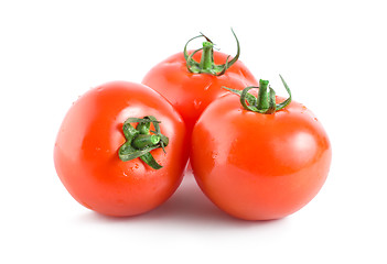 Image showing Three red tomatoes isolated