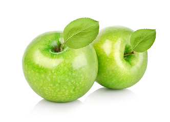 Image showing Two green apples with leaves