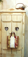 Image showing Bag hanging on a closet