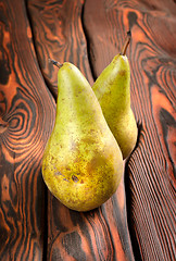 Image showing Two pears on an old wooden background