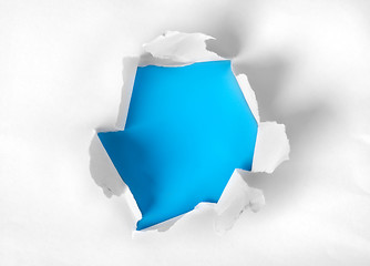 Image showing Paper torn with blue background