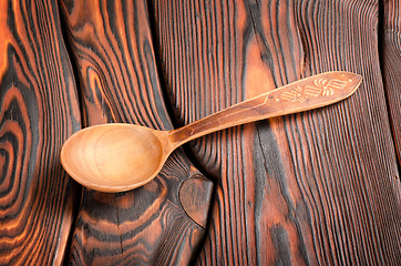 Image showing Wooden spoon on the wooden background