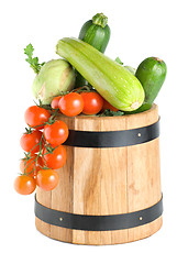 Image showing Wooden barrel with vegetables isolated