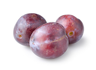 Image showing Three plums isolated