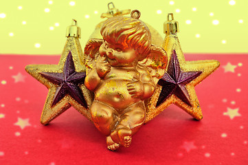 Image showing cupid and golden xmas stars