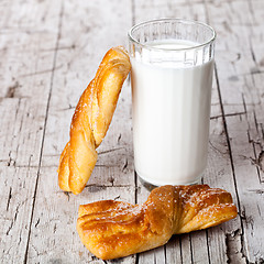 Image showing glass of milk and two fresh baked buns