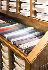 Image showing Ties stacked on a shelf in a store