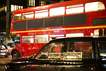 Image showing Red vintage bus and classic style taxi in London. 