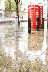 Image showing Rainy day.Red Phone cabines in London