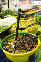 Image showing Olives in bowls in a shop