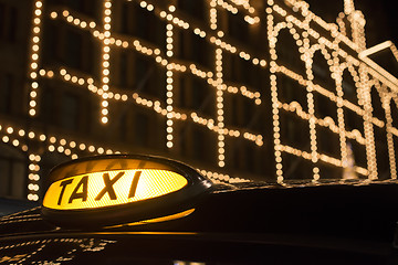 Image showing Taxi in London in front of a shopping center