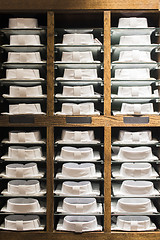 Image showing Shirts stacked on a shelf in a store