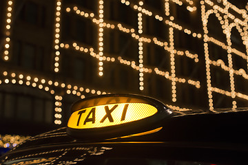 Image showing Taxi in London in front of a shopping center