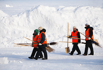 Image showing PETROZAVODSK, RUSSIA ? FEBRUARY 18: janitors with shovels and br