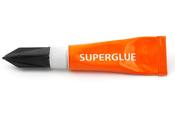 Image showing orange plastic tube labeled superglue