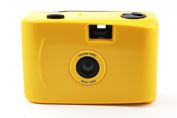 Image showing yellow camera shoot and go over white