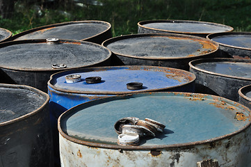 Image showing rusty metal barrels