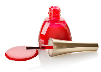 Image showing Red nail polish and brush