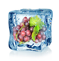 Image showing Ice cube and blue grapes