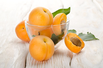 Image showing Apricots on a wooden background