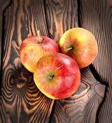 Image showing Red apples on the wooden table