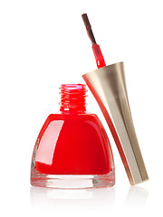 Image showing Red nail polish and brush isolated