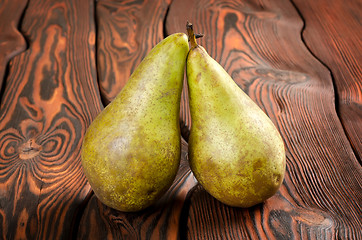 Image showing Two pears wooden on an background